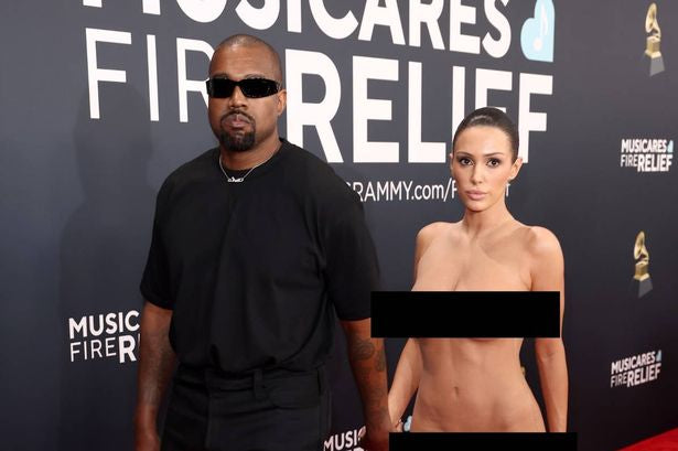 Kanye West and completely naked Bianca Cesnori walk the red carpet hand in hand at the Grammy's.